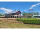 Community clubhouse featuring a pool and slide, perfect for Gathering fun and relaxation in the sun at 240 Liberty Star Rd, Wendell, NC 27591