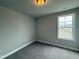 Cozy bedroom features neutral tones, gray carpet, and a bright window at 244 Bluejay St, Clayton, NC 27520