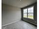 Neutral painted bedroom with a large window and new carpet with plastic protection at 244 Bluejay St, Clayton, NC 27520