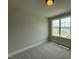 Bedroom features gray carpet and a large window that provides natural light at 244 Bluejay St, Clayton, NC 27520