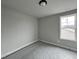 Neutral painted bedroom with a large window and new carpet with plastic protection at 244 Bluejay St, Clayton, NC 27520