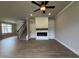 Cozy living room featuring a fireplace, built-in shelving, and hardwood floors at 244 Bluejay St, Clayton, NC 27520