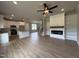 Open concept living space seamlessly blends kitchen, fireplace, and staircase at 244 Bluejay St, Clayton, NC 27520