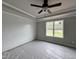 Spacious primary bedroom with trey ceiling, ship lap accent wall, and a large window at 244 Bluejay St, Clayton, NC 27520