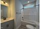 Bathroom featuring a single vanity sink, a bathtub/shower combo and tile flooring at 250 Bluejay St, Clayton, NC 27520
