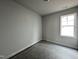 Well-lit bedroom with large windows and new flooring at 250 Bluejay St, Clayton, NC 27520