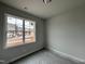 Well-lit bedroom with large windows and new flooring at 250 Bluejay St, Clayton, NC 27520