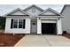 Charming one-story home with white siding, black shutters, and an attached one car garage at 250 Bluejay St, Clayton, NC 27520