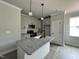 Bright kitchen with a center island, stainless steel appliances and a modern design at 250 Bluejay St, Clayton, NC 27520