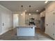 Open concept kitchen featuring island with granite countertop, and stainless steel appliances at 250 Bluejay St, Clayton, NC 27520