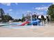 Community pool area features a splashpad, slide, seating, and a lifeguard station at 250 Bluejay St, Clayton, NC 27520
