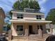 Charming two-story home featuring a welcoming front porch with brick accents and a classic architectural design at 2654 Lawndale, Durham, NC 27705