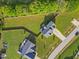 Aerial view of two homes with large, green yards and mature trees providing privacy at 28 Lee Woods Dr, Clayton, NC 27520