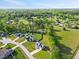 Aerial view showcasing the homes in a community surrounded by green spaces and mature trees at 28 Lee Woods Dr, Clayton, NC 27520
