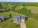 Aerial image of a home with a long driveway and big fenced backyard at 28 Lee Woods Dr, Clayton, NC 27520