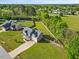 Aerial view of a well-maintained home with a large, landscaped yard and mature trees at 28 Lee Woods Dr, Clayton, NC 27520