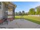 Expansive backyard featuring a brick-paver patio leading to a large, grassy lawn at 28 Lee Woods Dr, Clayton, NC 27520