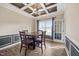 Formal dining room featuring coffered ceilings, wainscoting and a chandelier at 28 Lee Woods Dr, Clayton, NC 27520