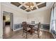 An elegant dining room with coffered ceilings and natural light from a large window at 28 Lee Woods Dr, Clayton, NC 27520