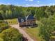 Beautiful brick home with a long driveway, mature trees, and well-maintained lawn at 2804 Brenfield Dr, Raleigh, NC 27606
