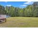 View from the deck of the large backyard with a detached shed at 2804 Brenfield Dr, Raleigh, NC 27606