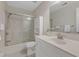 Well-lit bathroom featuring a shower over tub and a decorative vanity with flowers at 2804 Brenfield Dr, Raleigh, NC 27606