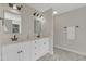 Bright bathroom with double sink vanity, stylish fixtures and a marble floor at 2804 Brenfield Dr, Raleigh, NC 27606