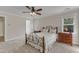 Comfortable bedroom with neutral carpet, ceiling fan, lots of natural light, and relaxing atmosphere at 2804 Brenfield Dr, Raleigh, NC 27606