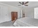 Inviting bedroom with neutral carpet, ceiling fan, and a dark wood dresser for storage at 2804 Brenfield Dr, Raleigh, NC 27606