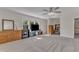 Open concept bonus room with a ceiling fan, large windows for plenty of light, and neutral carpet at 2804 Brenfield Dr, Raleigh, NC 27606