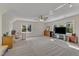 Spacious bonus room with neutral carpet, ceiling fan, large windows, and ample natural light at 2804 Brenfield Dr, Raleigh, NC 27606