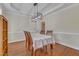 Bright dining room featuring modern lighting, hardwood floors, and ample space at 2804 Brenfield Dr, Raleigh, NC 27606