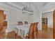 Traditional dining room featuring a table with four chairs and a modern light fixture at 2804 Brenfield Dr, Raleigh, NC 27606