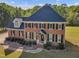Charming brick home with mature landscaping and a welcoming entrance at 2804 Brenfield Dr, Raleigh, NC 27606