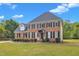 Attractive two-story brick home featuring a well-kept front lawn and black shutters at 2804 Brenfield Dr, Raleigh, NC 27606