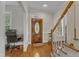 Inviting foyer featuring hardwood floors, a staircase, and a beautiful front door at 2804 Brenfield Dr, Raleigh, NC 27606