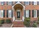 Close-up of the home's welcoming front door with decorative glass and sidelights at 2804 Brenfield Dr, Raleigh, NC 27606