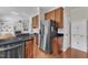 An open kitchen with stainless steel appliances and dark granite countertops blends into the living room at 2804 Brenfield Dr, Raleigh, NC 27606