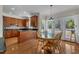 Charming kitchen with light wood cabinetry, granite counters, and a cozy breakfast nook for casual dining at 2804 Brenfield Dr, Raleigh, NC 27606