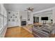 Spacious living room featuring a fireplace with shelving, and hardwood floors at 2804 Brenfield Dr, Raleigh, NC 27606