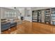 Bright and airy living room with a fireplace, built-in shelving, and large windows at 2804 Brenfield Dr, Raleigh, NC 27606