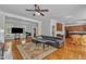 Open-concept living room with hardwood floors connecting to a dining area and kitchen at 2804 Brenfield Dr, Raleigh, NC 27606