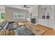 Warm living room area with large windows overlooking the outdoor landscape at 2804 Brenfield Dr, Raleigh, NC 27606