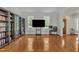 Bright living room boasts hardwood floors, built-in bookshelves and large windows, perfect for relaxing or entertaining at 2804 Brenfield Dr, Raleigh, NC 27606