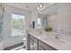 Bright bathroom featuring a double vanity, large mirror, and lots of natural light at 3011 Ginger Hill Ln, Durham, NC 27703