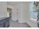 Bright foyer with gray wood flooring, a console table, and views into other rooms at 3011 Ginger Hill Ln, Durham, NC 27703