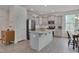 Spacious kitchen with gray cabinetry, a granite island, and stainless steel appliances at 3011 Ginger Hill Ln, Durham, NC 27703