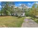 Delightful home with a driveway and plenty of curb appeal with its manicured lawn at 308 Plaza Dr, Garner, NC 27529