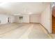 Unfinished basement with stairs leading up to the main level at 317 William Dr, Benson, NC 27504