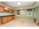Finished basement with wood cabinets, a workspace area, and natural lighting at 317 William Dr, Benson, NC 27504